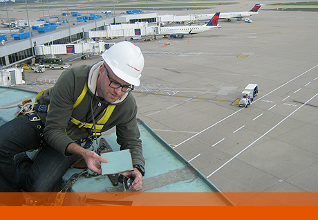 Project Director Chuck Van Winckle reviews tornado damage at the Lambert-St. Louis Airport. Project Director Chuck Van Winckle reviews tornado damage at the Lambert-St. Louis Airport.